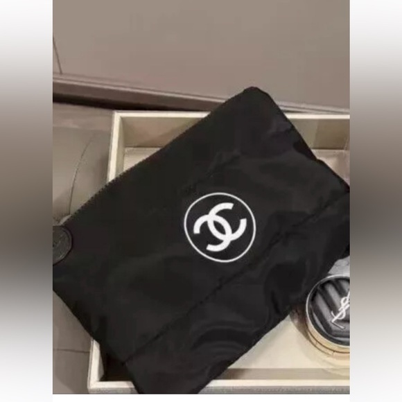 CHANEL Handbags - CHANEL Black Cosmetic Pouch with White Logo
